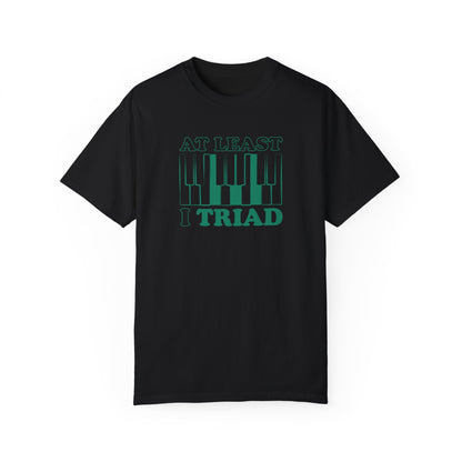 Tee Shirt with Piano Keys, an F major chord is highlighted.  Above read the words "At least I Triad".  Black shirt.