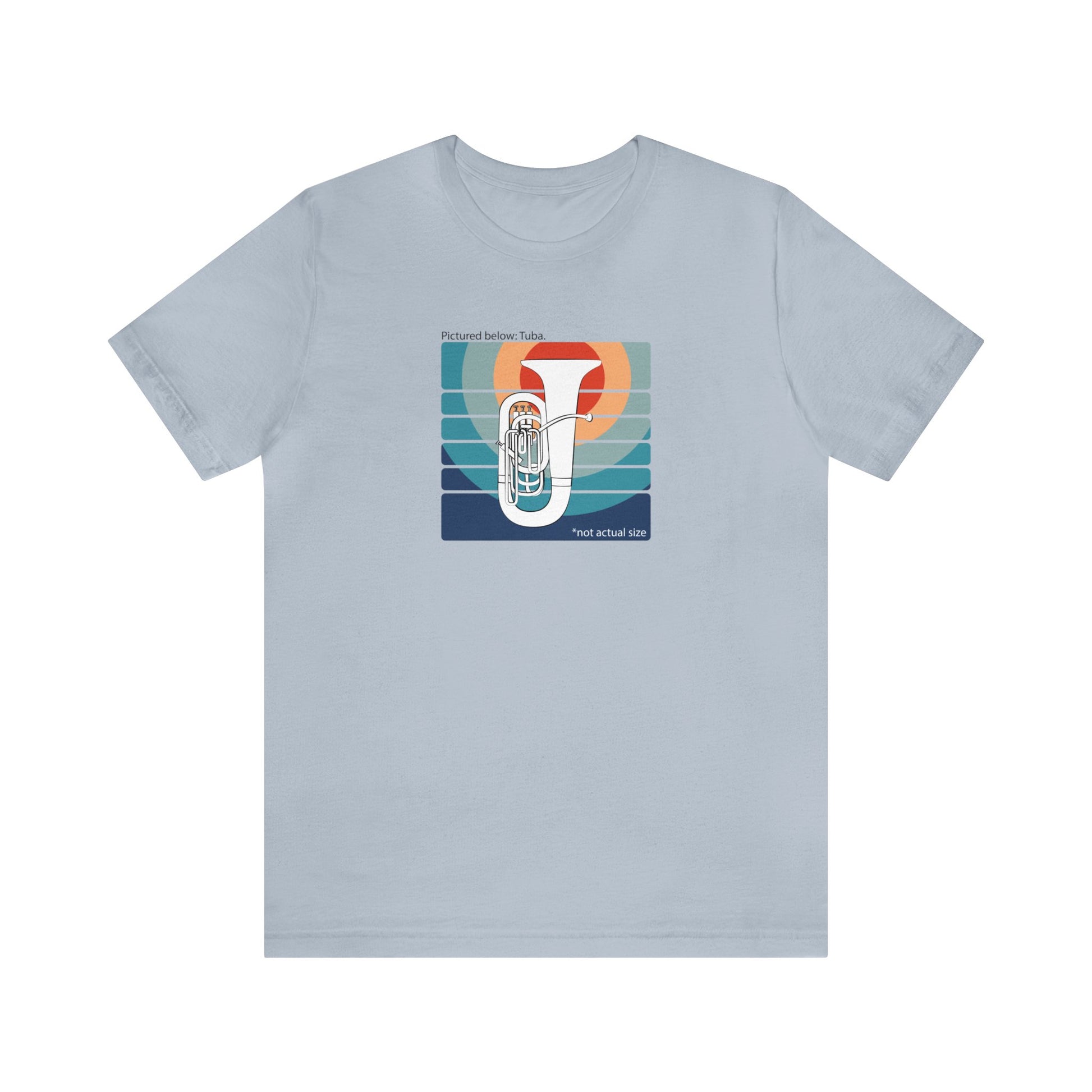 Graphic Music T-shirt with an image of a tuba on colorful background and the words "Pictured below: Tuba" and "Not Actual Size." Light blue shirt.