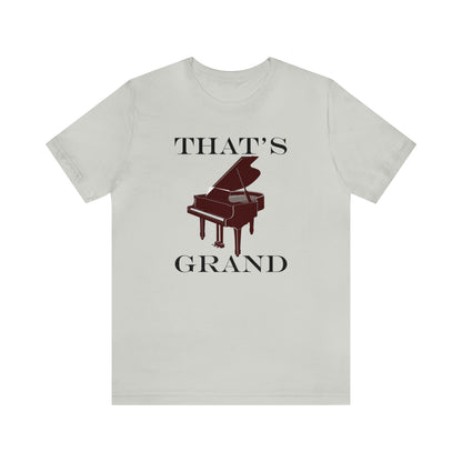 A graphic music pun t-shirt with an image of a grand piano and the words "That's Grand". Light grey shirt.