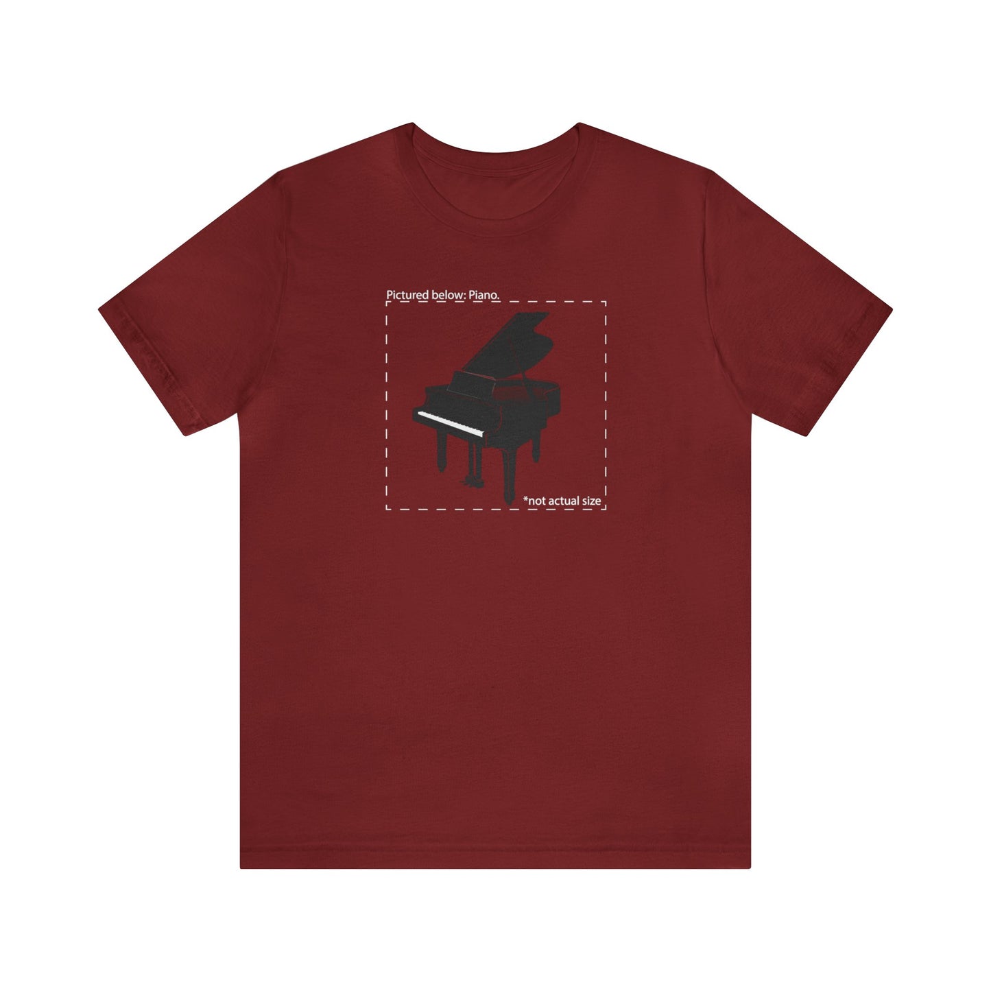 Graphic music t-shirt.  A grand piano and the words "Pictured Below: Piano" followed by the text "Not actual size."  Red shirt.