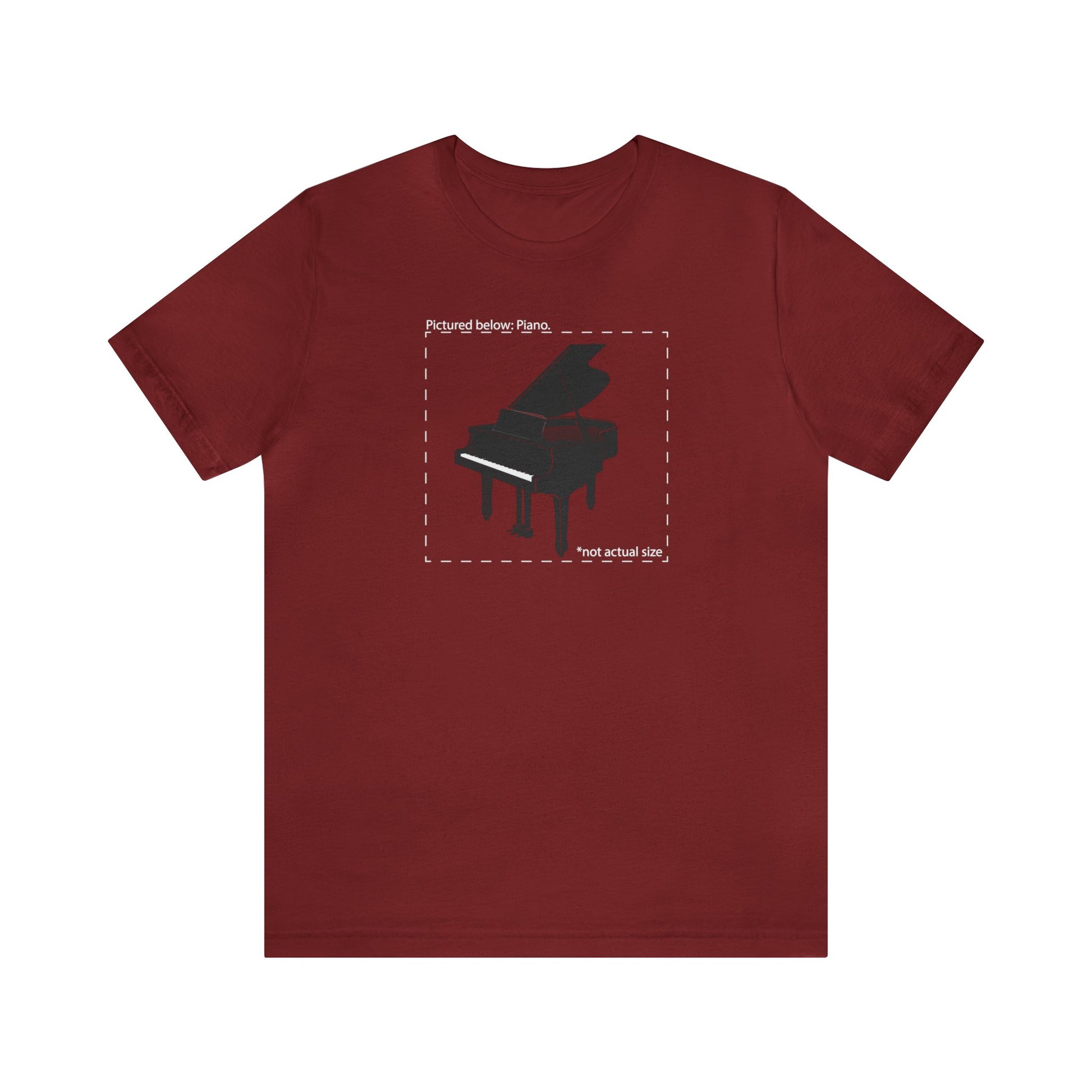 Graphic music t-shirt.  A grand piano and the words "Pictured Below: Piano" followed by the text "Not actual size."  Red shirt.