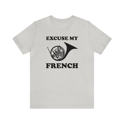 A music pun t-shirt with the phrase "excuse my French" and a simple graphic of a french horn.  Text and graphic are black, t-shirt color is light gray.