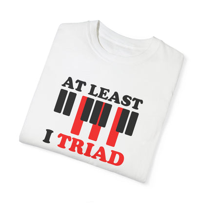 Tee Shirt with Piano Keys, an F major chord is highlighted.  Above read the words "At least I Triad".  White shirt.