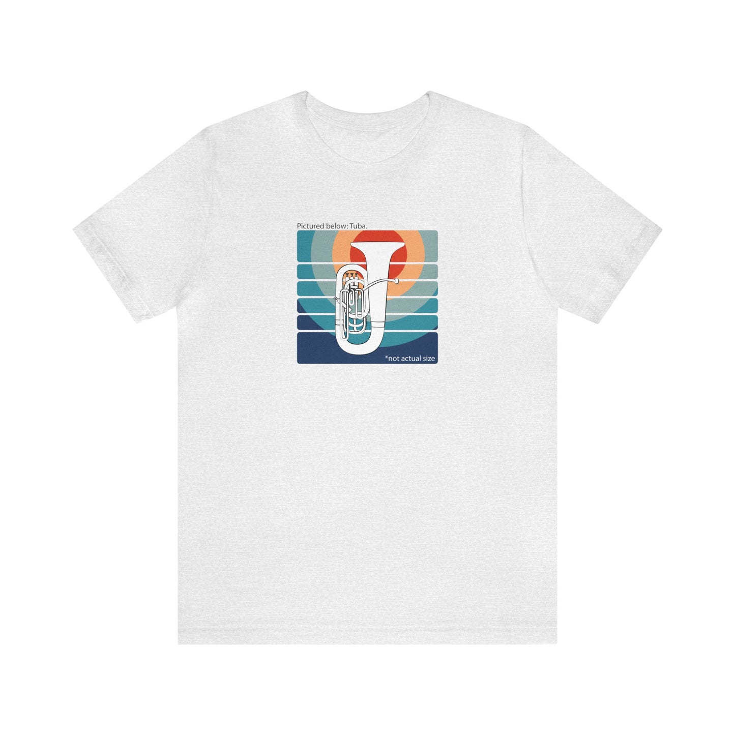 Graphic Music T-shirt with an image of a tuba on colorful background and the words "Pictured below: Tuba" and "Not Actual Size." Light grey shirt.