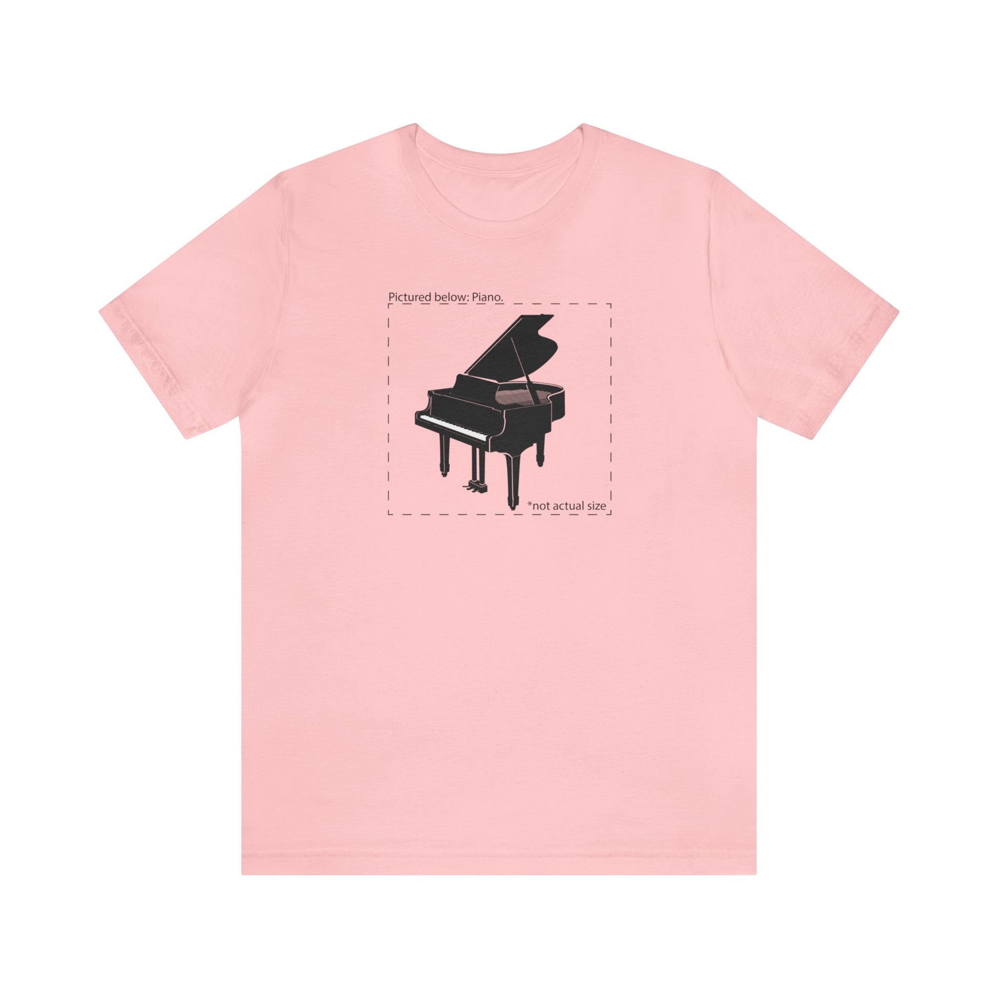 Graphic music t-shirt.  A grand piano and the words "Pictured Below: Piano" followed by the text "Not actual size."  Pink shirt.