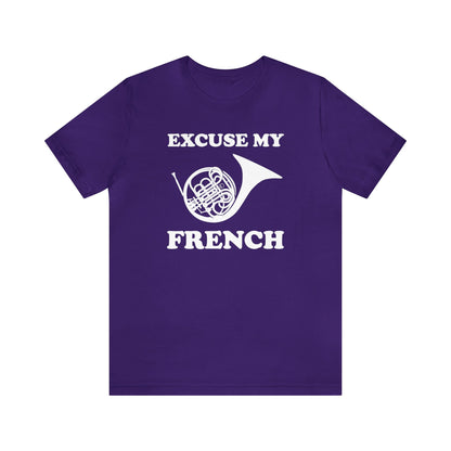 A music pun t-shirt with the phrase "excuse my French" and a simple graphic of a french horn.  Text and graphic are black, t-shirt color is royal purple.