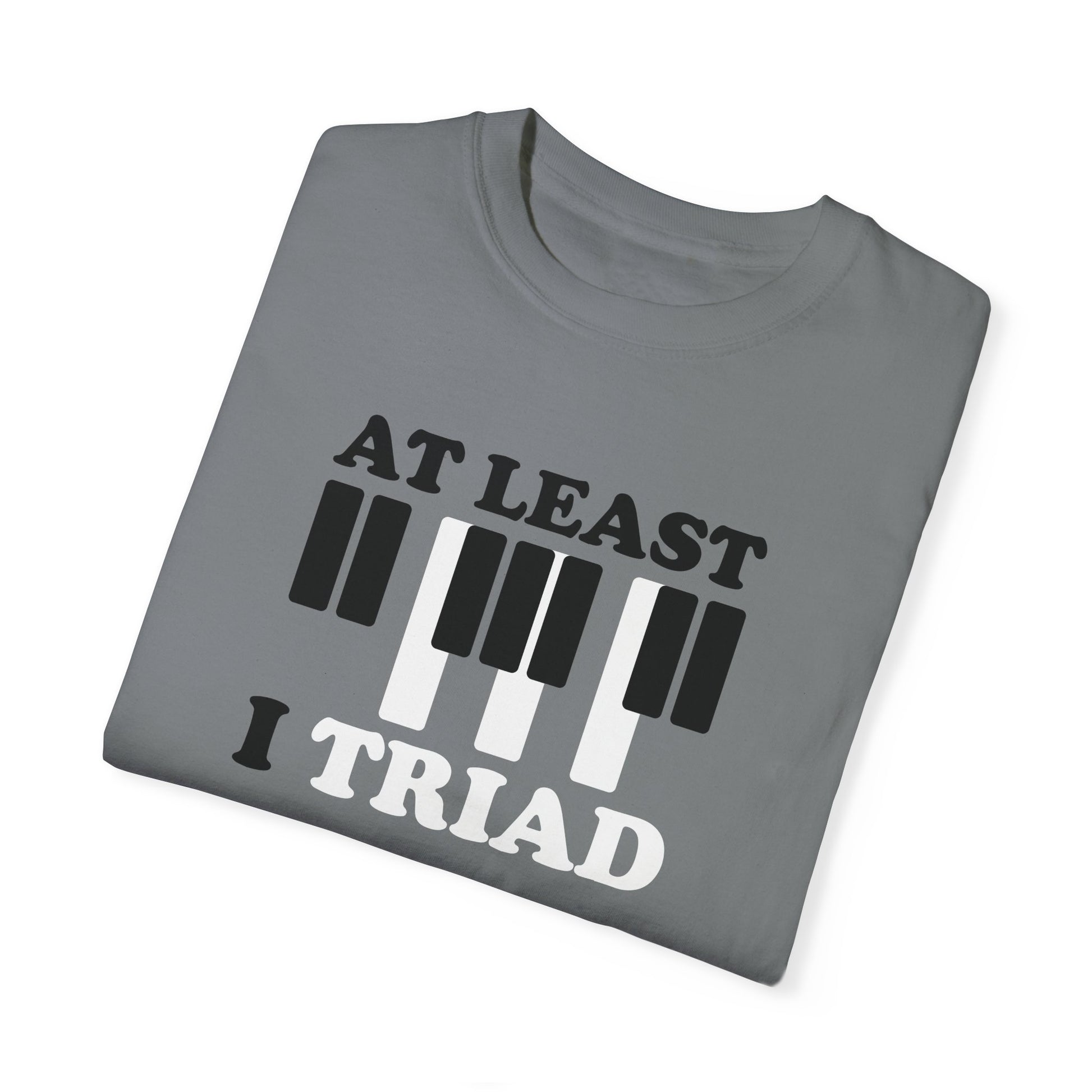 Tee Shirt with Piano Keys, an F major chord is highlighted.  Above read the words "At least I Triad".  Grey Shirt.